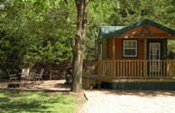 Deluxe cabin with propane grill and fire pit.